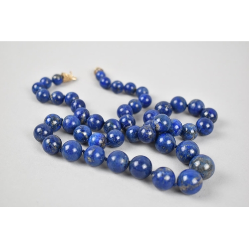 343 - A Graduated Single Row Lapis Lazuli Bead Necklace, 63cm