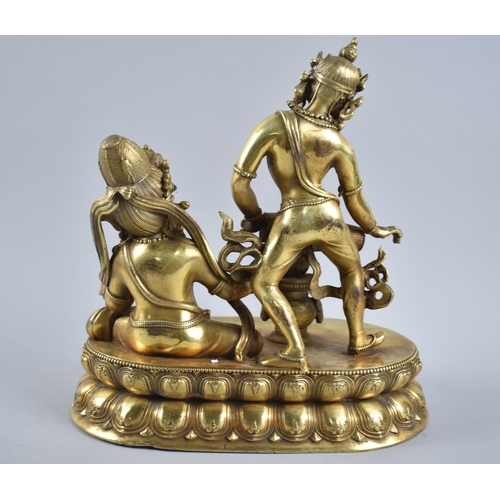 38 - A Thai Gilt Bronze Figure Group Depicting Seated God and Goddess Playing Drum, on Oval Lotus Throne,... 