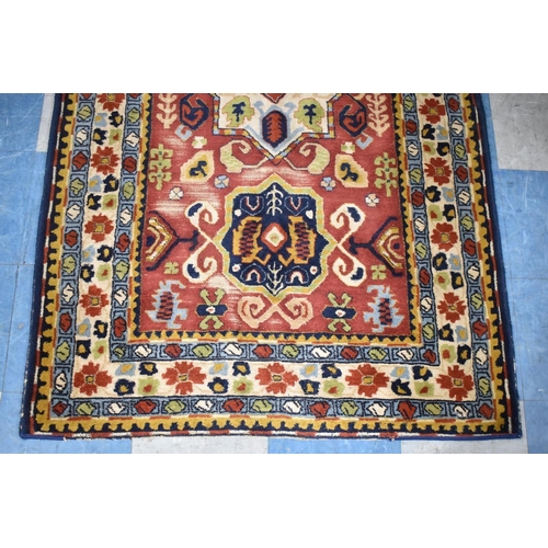 413 - An Antique Tetex Patterned Rug, 192x115cm