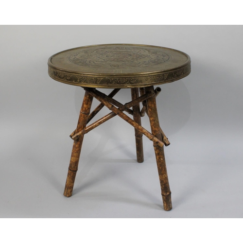 415 - An Indian Circular Brass Top Table on Tripod Bamboo Base, 60cm Diameter