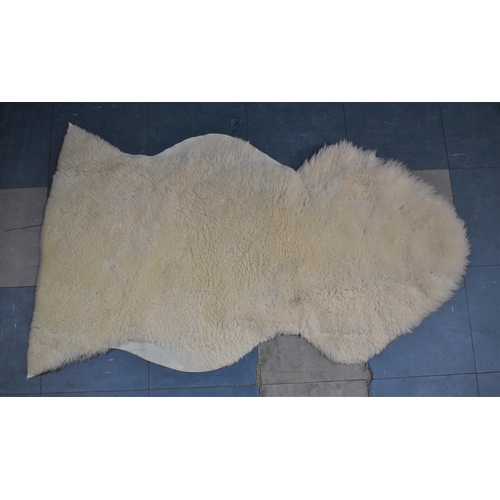 424 - A Sheepskin Rug, 125cm x 68cm