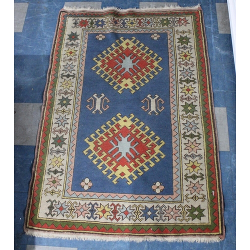 434 - A Patterned Woollen Rug, 165x111cm