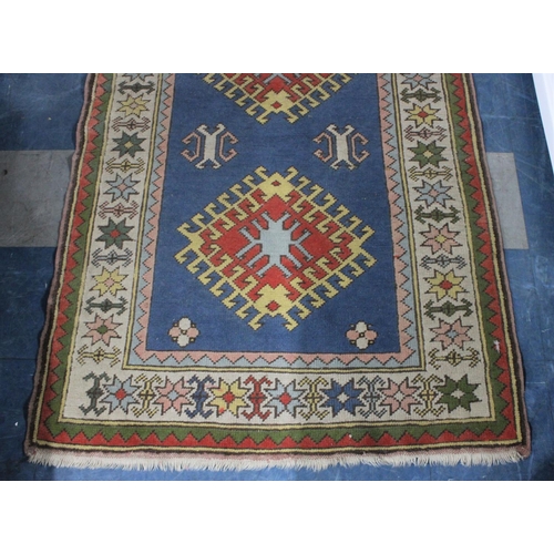 434 - A Patterned Woollen Rug, 165x111cm