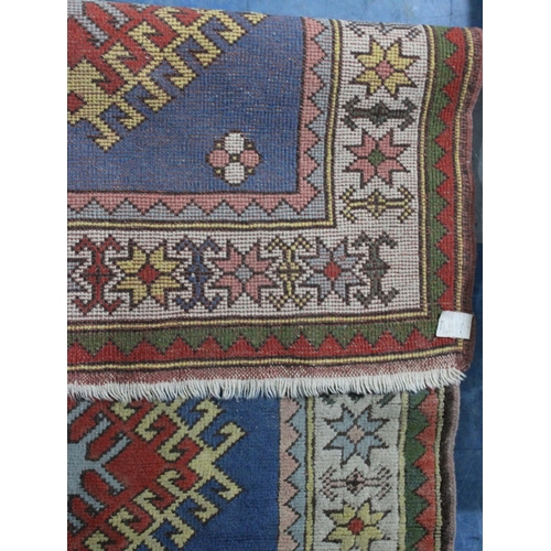 434 - A Patterned Woollen Rug, 165x111cm