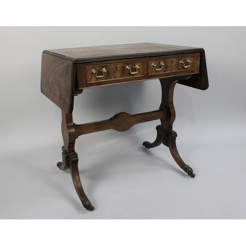 448 - An Edwardian Drop Leaf Two Drawer Sofa Table, the Scrolled Supports Culminating in Claw Feet with Ca... 