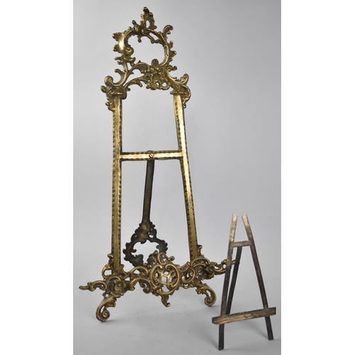 67 - A Large Cast Brass Tabletop Picture Easel, 52cm high Together with a Smaller Silver Plated Example