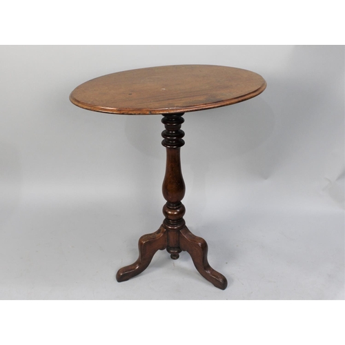 70 - A Victorian Mahogany Oval Snap Top Tripod Table, 65cm wide