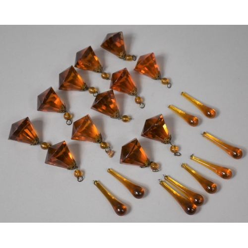 90 - A Collection of Amber Coloured Glass Bead Droppers