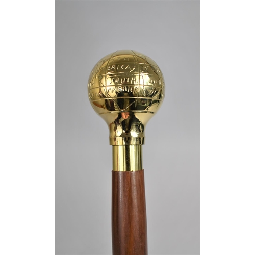 10 - A Modern Turned Wooden Walking Cane with Polished Brass Handle Decorated with Naive Map of The World