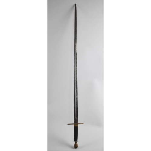 109 - A Vintage Sword with Fullered Blade and Wooden Handle, 84cms Long