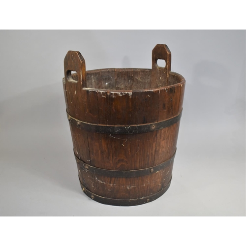 139 - A Cylindrical Coopered Log Box with Two Carrying Handles, 43cms Diameter and 52cms High