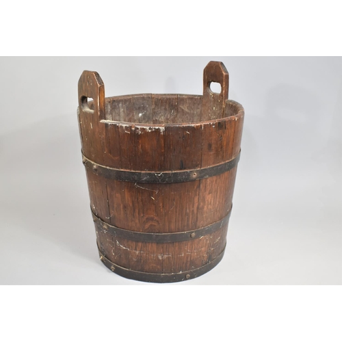 139 - A Cylindrical Coopered Log Box with Two Carrying Handles, 43cms Diameter and 52cms High