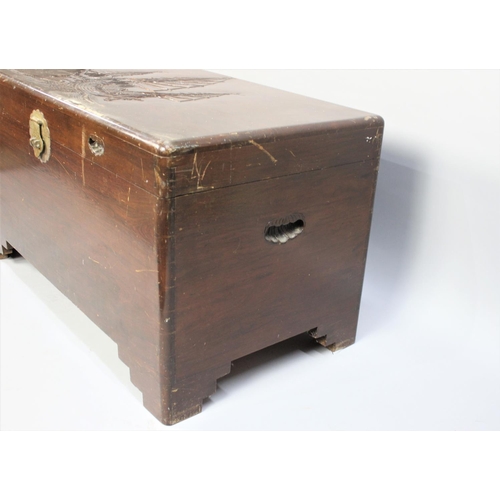 454 - An Oriental Camphor Wood Chest with Carved Lid Depicting Three Masted Ship, 100cm wide