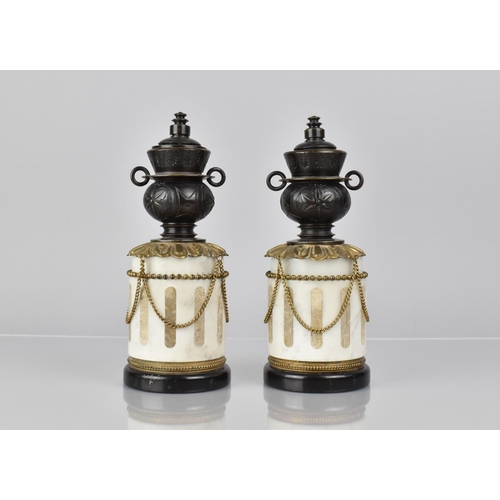 63 - A Pair of French Bronze and Marble Garnitures of Cylindrical Form with Two Handled Vase having Rever... 