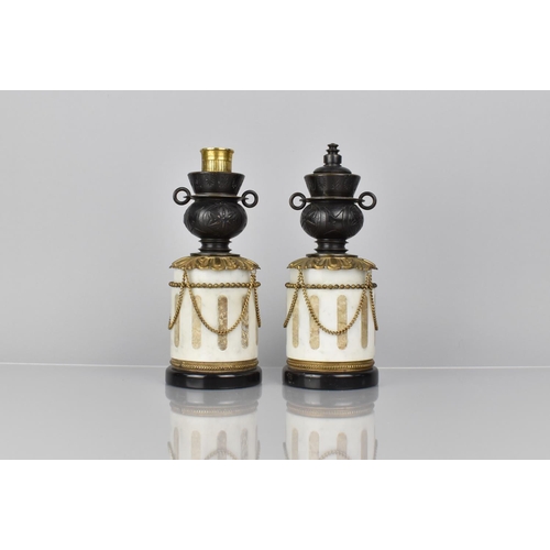 63 - A Pair of French Bronze and Marble Garnitures of Cylindrical Form with Two Handled Vase having Rever... 