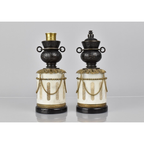 63 - A Pair of French Bronze and Marble Garnitures of Cylindrical Form with Two Handled Vase having Rever... 