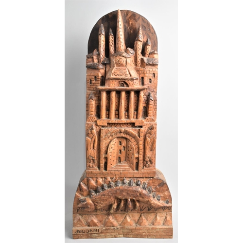 91 - A Carved Wooden Study of a Medieval Tower with Dragon Before, Signed Soudani, 45cms High