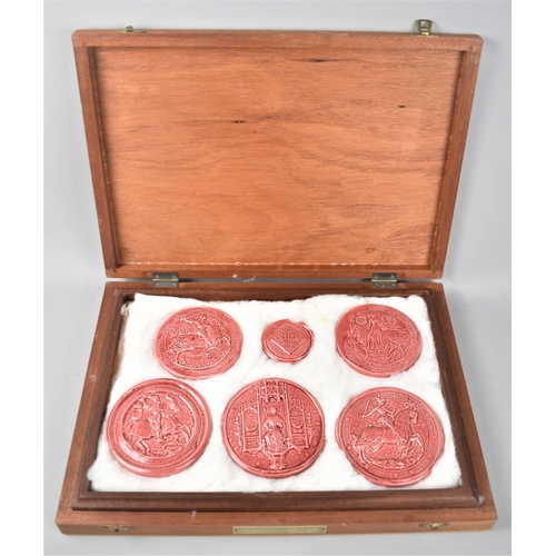 92 - A Cased Set of Five Pink Glazed Plaster Copies of Legal Document Seals together with a Small Quantit... 