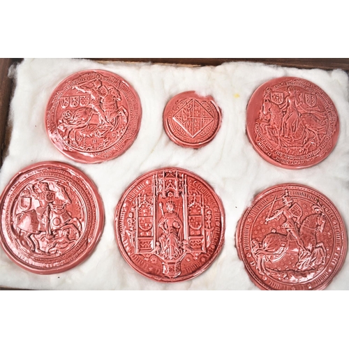 92 - A Cased Set of Five Pink Glazed Plaster Copies of Legal Document Seals together with a Small Quantit... 