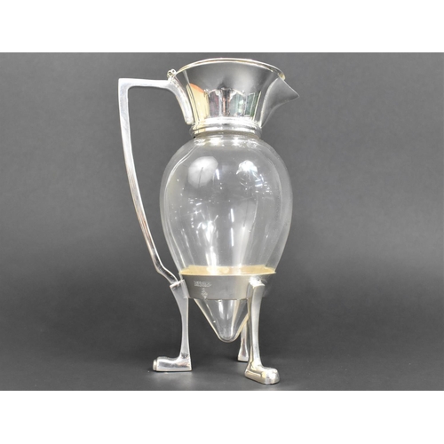 93 - A Silver Plated and Glass Lidded Claret Jug in the Style of Christopher Dresser, 26cms High