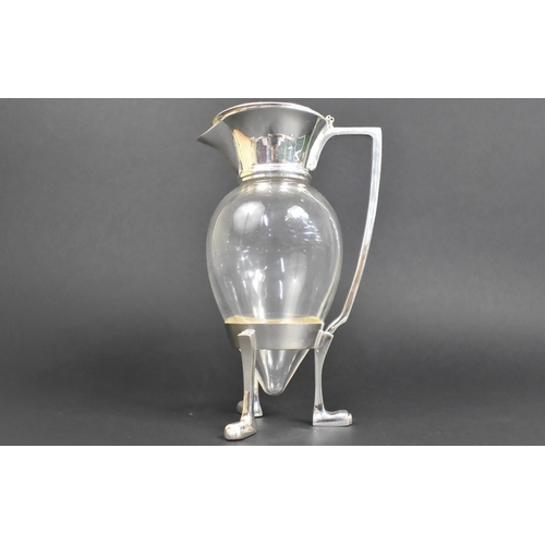 93 - A Silver Plated and Glass Lidded Claret Jug in the Style of Christopher Dresser, 26cms High