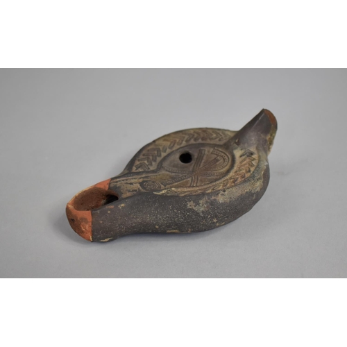 9 - A Terracotta Oil Lamp with Incised Decoration, Some Chips, 13cms Long