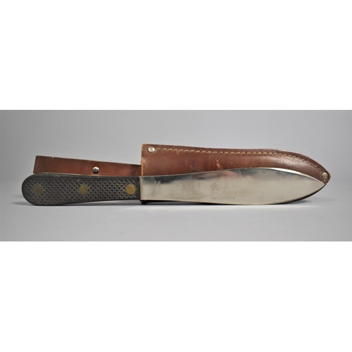 39 - An Italian Whitby Throwing Knife in Leather Sheath, 23.5cms Long