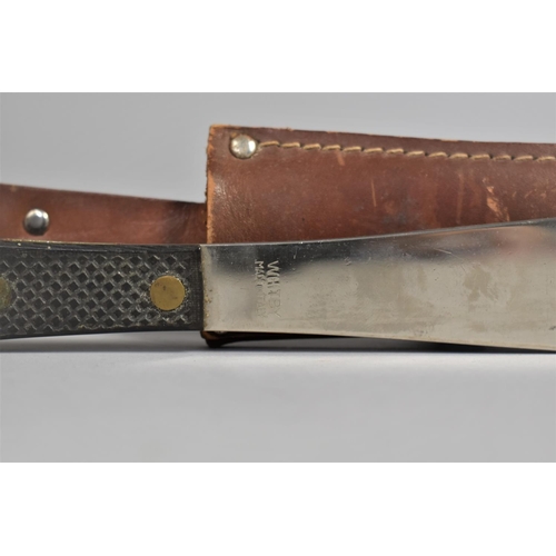 39 - An Italian Whitby Throwing Knife in Leather Sheath, 23.5cms Long