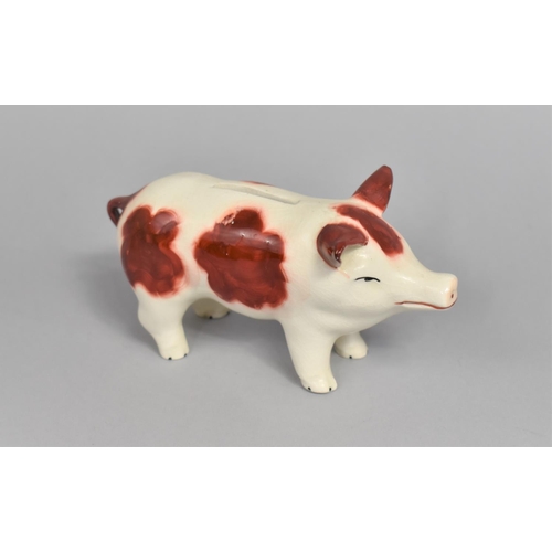 44 - A Glazed Ceramic Novelty Money Box in the Form of a Pig, 13.5cms Long