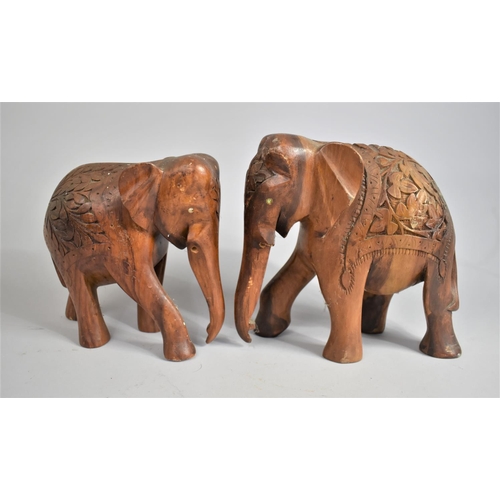 60 - A Carved Far Eastern rectangular Box and Two Similar Souvenir Elephants, 23cms High