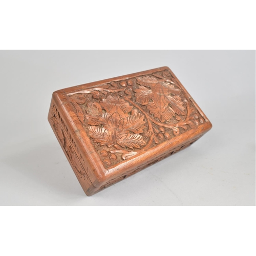 60 - A Carved Far Eastern rectangular Box and Two Similar Souvenir Elephants, 23cms High