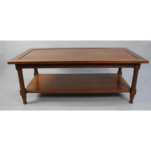 102 - A Modern Rectangular Coffee Table with Turned Supports and Stretcher Shelf, 121cms Wide