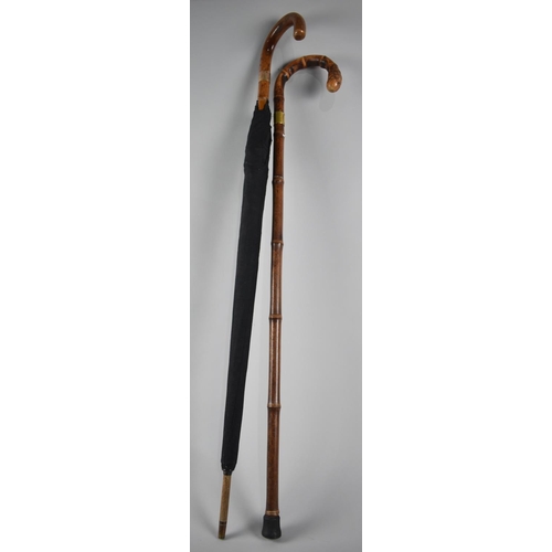 105 - A Swaine and Brigg Bamboo Walking Stick with Gold Plated Mount together with a Similar Umbrella