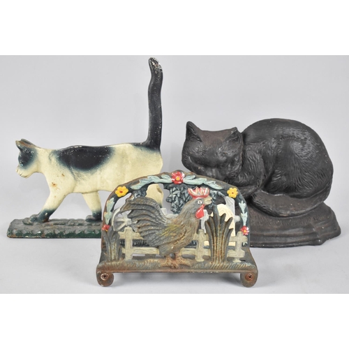 106 - Two Modern Cast Iron Cold Painted Doorstops in the Form of Cats together with a Letter Rack in the F... 