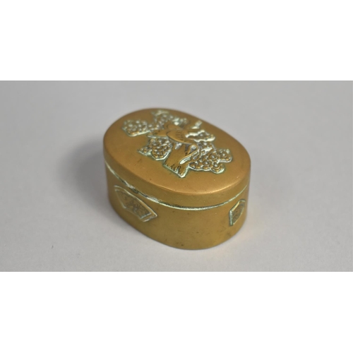 21 - A Vintage Pressed Brass oval Pill Box, Hinged Lid Decorated with Bird and Tree, 5.25cms Wide