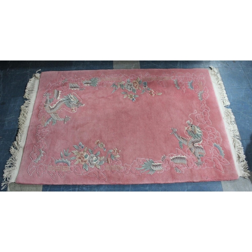 456 - A Patterned Chinese Woollen Rug on Pink Ground, 189x125cm