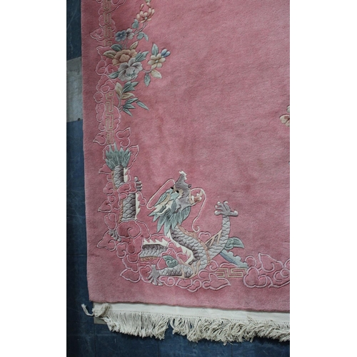 456 - A Patterned Chinese Woollen Rug on Pink Ground, 189x125cm