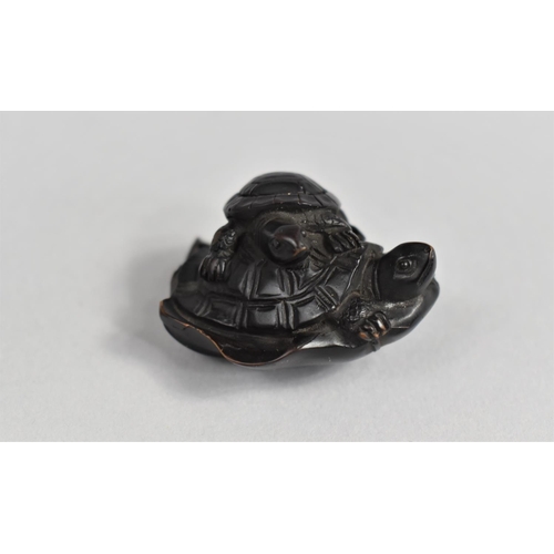 55 - A Finely Carved Wooden Netsuke, Young Tortoise Riding Mother on Lily Pad, 3.5cms Long