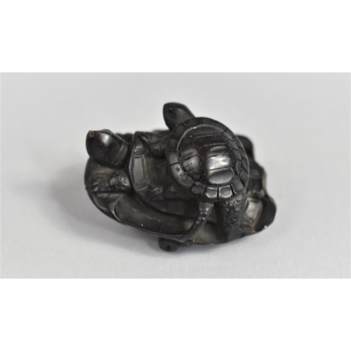 55 - A Finely Carved Wooden Netsuke, Young Tortoise Riding Mother on Lily Pad, 3.5cms Long