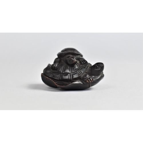 55 - A Finely Carved Wooden Netsuke, Young Tortoise Riding Mother on Lily Pad, 3.5cms Long