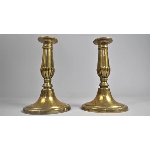 64 - A Pair of Georgian Style Brass Candlesticks on Oval Bases, 16cms High