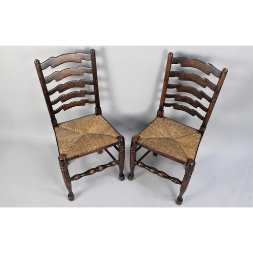 467 - A Pair of Reproduction Rush Seated North Country Style Ladder Back Chairs