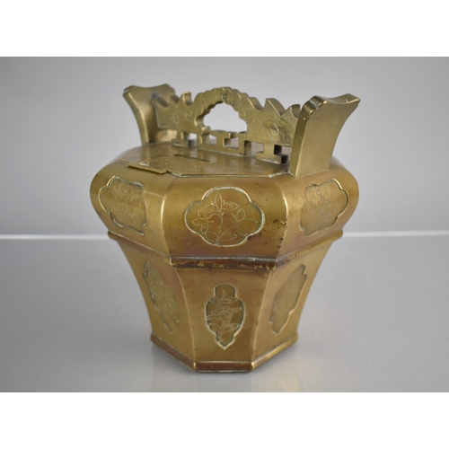 182 - A Chinese Bronze Teapot with Flat Octagonal Top with Ornate Scrolled Handle and Tapering Panelled Bo... 