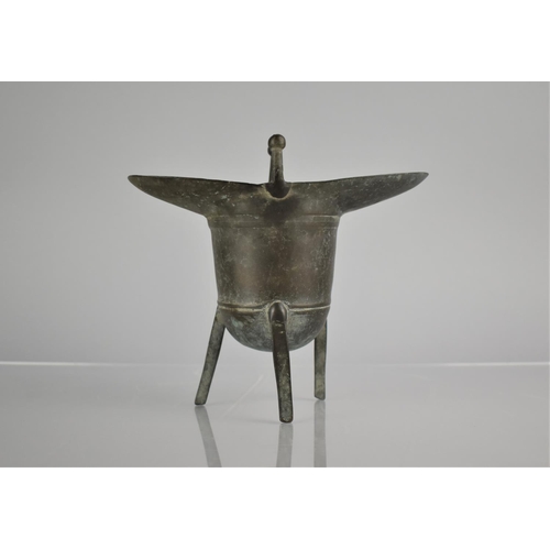 181 - A Chinese Cast Bronze Jue Wine Vessel of Archaic Form, 16.5cm high