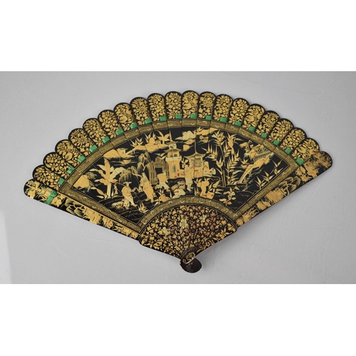 146 - A Late 19th Century Chinese Black Lacquered Brise Fan decorated in Gilt Enamels Depicting Robed Figu... 