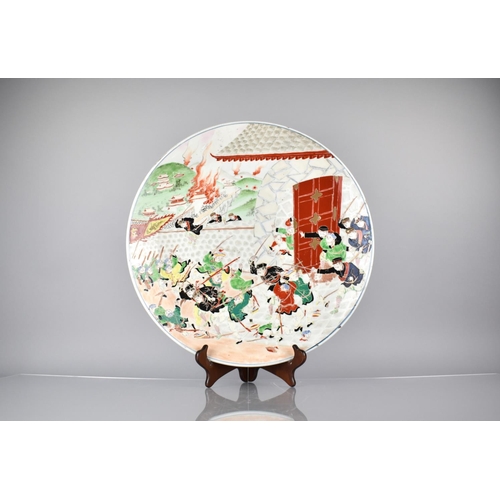 124 - A 20th Century Japanese Porcelain Charger decorated Sino-Japanese War Battle Scene in Polychrome Ena... 