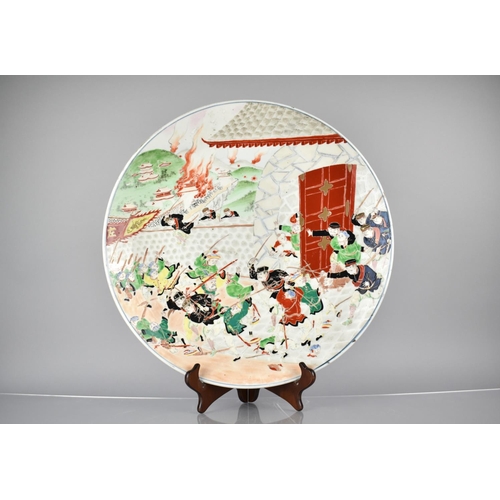 124 - A 20th Century Japanese Porcelain Charger decorated Sino-Japanese War Battle Scene in Polychrome Ena... 