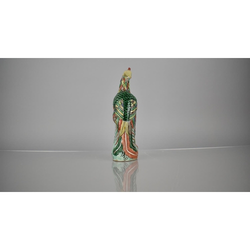 107 - A Chinese Porcelain Spill in the Form of a Phoenix decorated in Multi-coloured Enamels, 20.5cms High