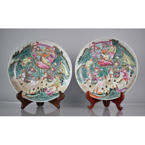 75 - A Pair of Chinese Porcelain Plates Decorated in the Famille Rose Palette with Battle Scene, the Reve... 