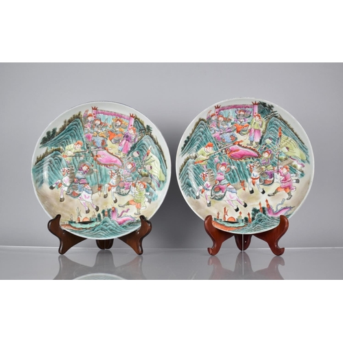 75 - A Pair of Chinese Porcelain Plates Decorated in the Famille Rose Palette with Battle Scene, the Reve... 